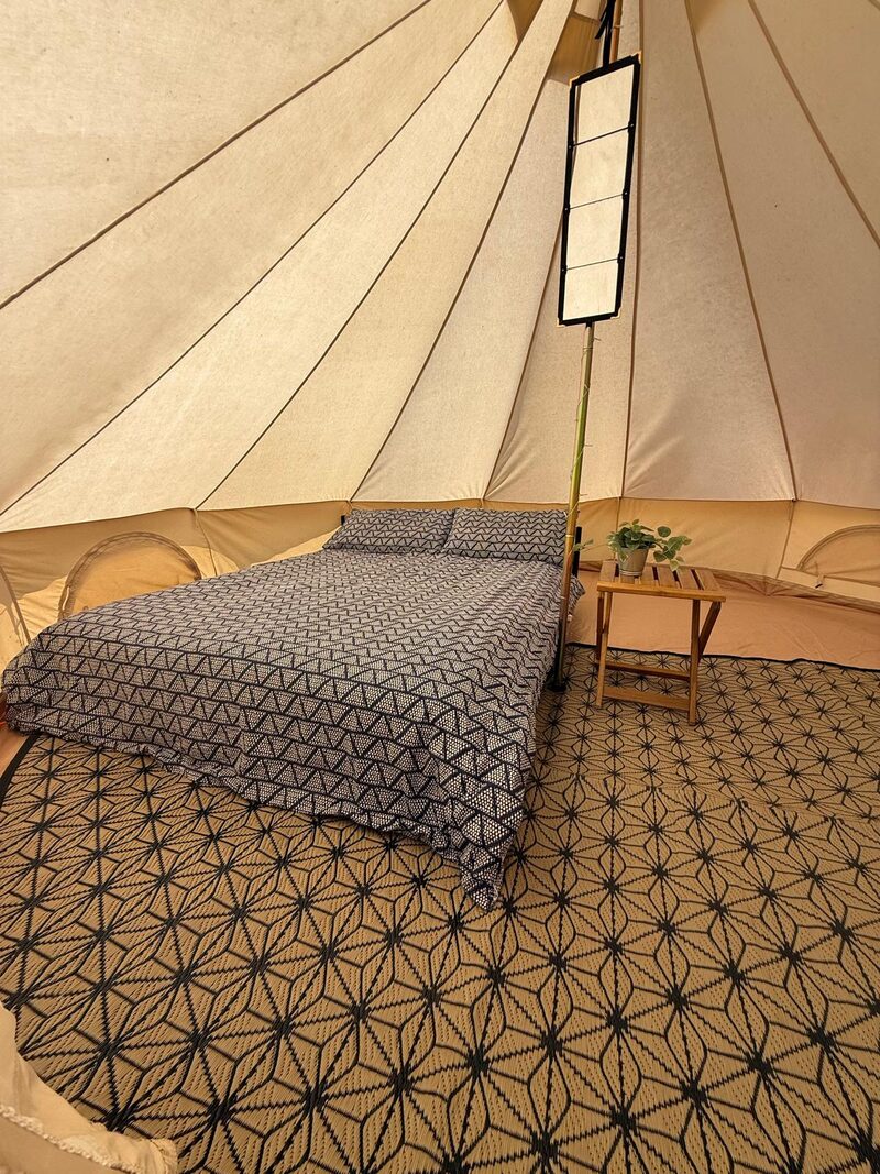 Bell tent with bedding